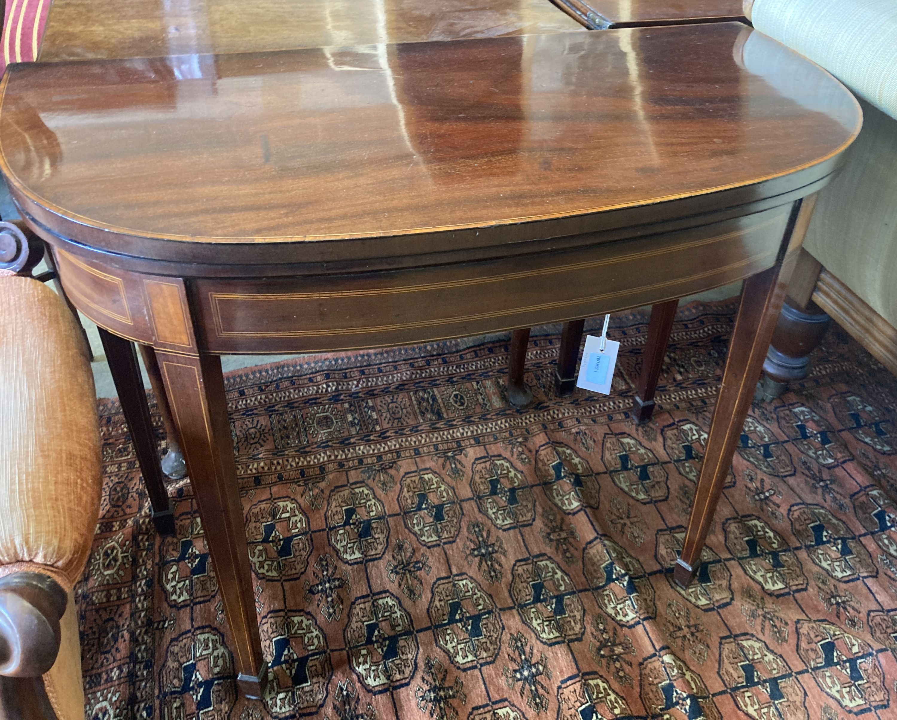 A George III line-inlaid mahogany D-shaped card table with folding top, width 90cm, depth 44cm, height 73cm